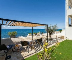 Mediterranean villa in the first row by the sea