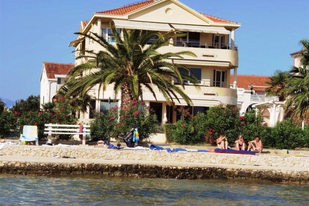 Spacious apartment for sale on the ground floor right by the sea in Croatia