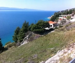 Омиш, Мимице, участок под застройку 1563 м², 90 м от моря