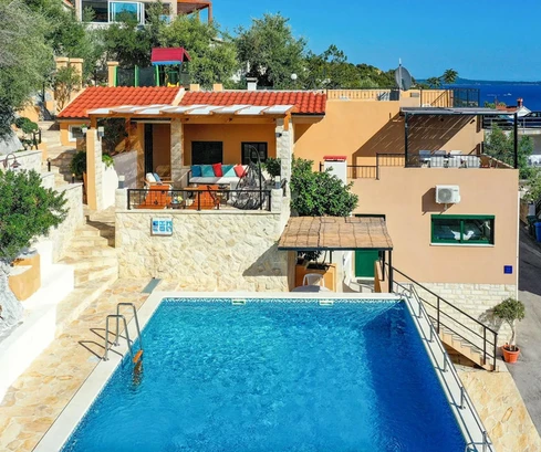 Detached home with a swimming pool for sale in Marina in Croatia
