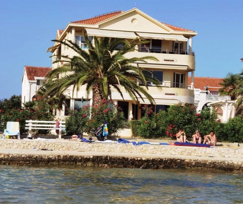 Spacious apartment for sale on the ground floor right by the sea in Croatia