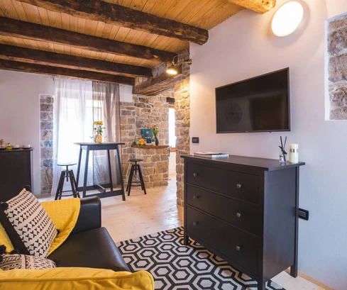 Row house with apartments and commercial spaces for sale in Oprtalj in Croatia