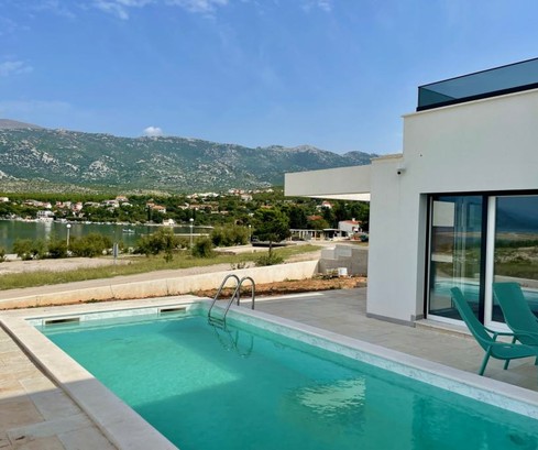 Luxury villa with a pool for sale right on the waterfront in Croatia
