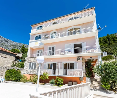 Spacious apartment building for sale in Drvenik, directly on the waterfront in Croatia