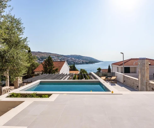 Family home for sale just 80 meters from the sea in Okrug in Croatia