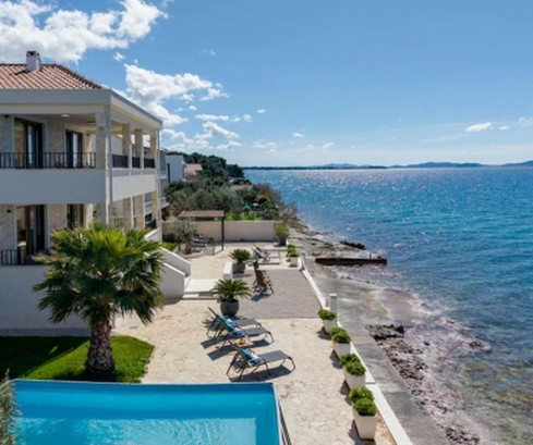 Mediterranean villa in the first row by the sea