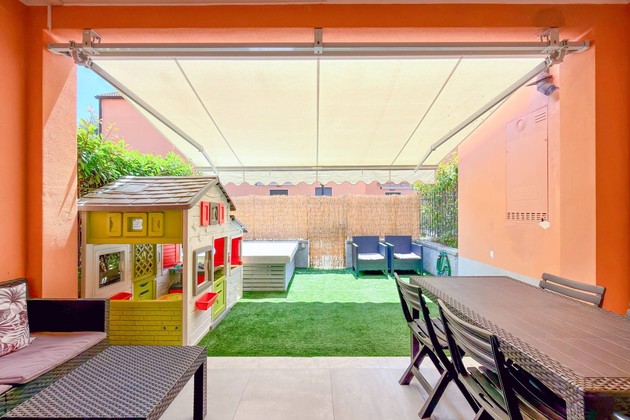 Modern terraced house on three levels with a private garden and double garage.
