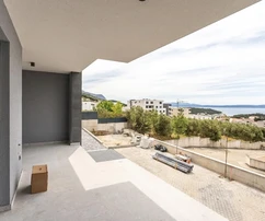 Makarska, apartamento de dos dormitorios con terraza y vista al mar en un nuevo desarrollo