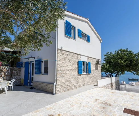 Charming two-story stone home for sale right on the waterfront in Croatia